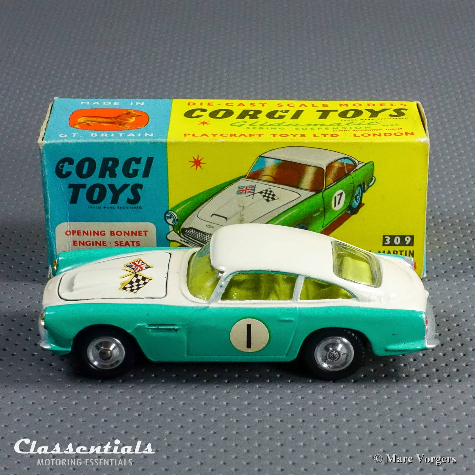 https://www.classentials.com/wp-content/uploads/2021/10/04-Corgi-Toys-Aston-Martin-Competition-model-number-309-early-open-scoop-vintage-original-die-cast-mint-classentials-01.jpg